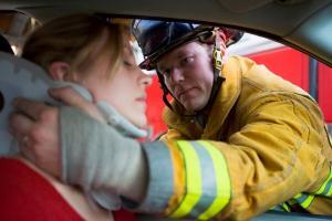 Fireman Putting Neckbrace On A Car Accident Victim