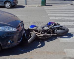 motorcycle under a car because the driver didnt see the motorcycle rider