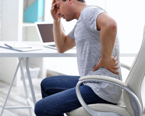 man suffering from back pain after a personal injury