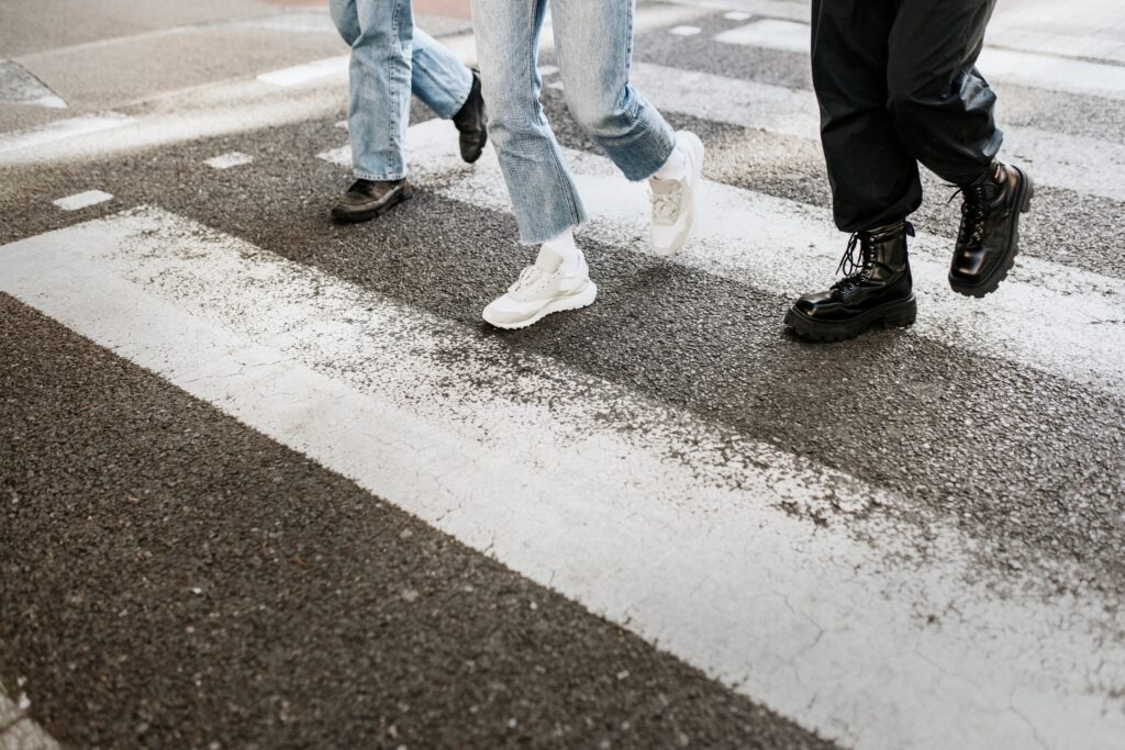 friends crossing the zebra cross on the road